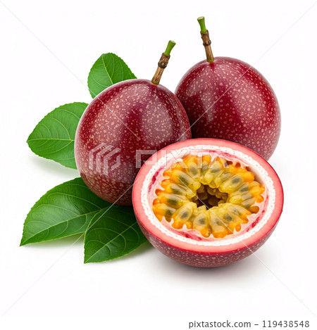 Two whole passion fruits and one half, showing their vibrant interior, with green leaves in the background 119438548