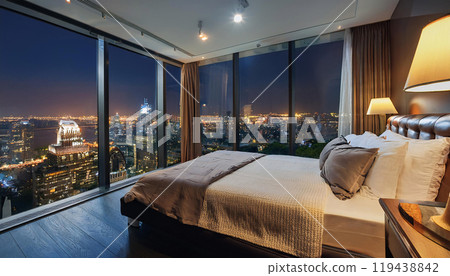 Modern bedroom with cityscape view at night 119438842