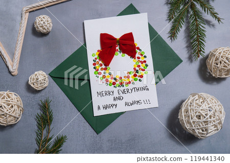 Christmas wreath Craft Christmas greeting card holiday present. Tactile hand-on activity. Creative me-made gifts. Seasonal domestic life micro moment hobby Christmas wreath Craft Christmas greeting card holiday present. Tactile hand-on activity. Creative me-made gifts. Seasonal domestic life micro moment hobby 119441340