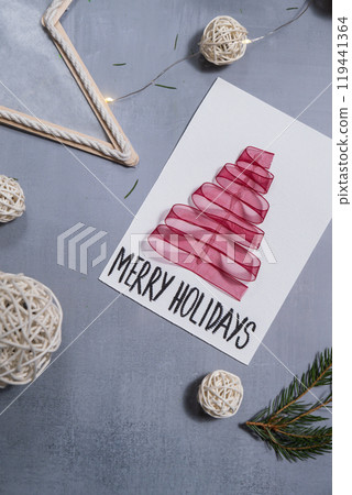 Christmas tree ribbon Storytelling of creating craft Christmas greeting card holiday present. Tactile hand-on activity. Master class progress of creative me-made gifts. Seasonal domestic life micro 119441364