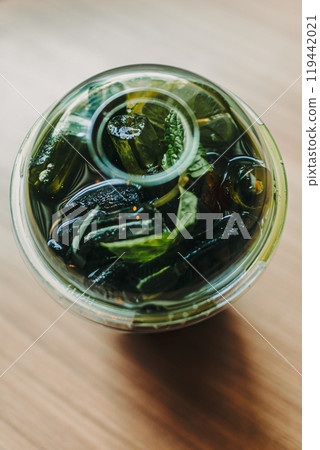 Plastic cup of iced green tea on the table. 119442021