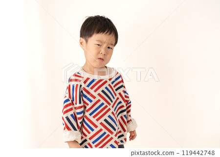 Boy with a displeased expression 119442748