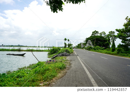 Scenic beauty of Wetland beside road at Kharibari Kolkata Scenic beauty of Wetland beside road at Kharibari Kolkata 119442857