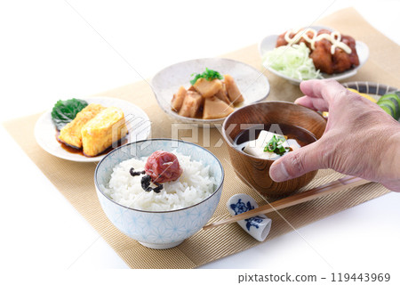 Image of a Japanese breakfast (rice, tamagoyaki (rolled egg), fried chicken, pickles, miso soup, and boiled bamboo shoots) Image of a Japanese breakfast (rice, tamagoyaki (rolled egg), fried chicken, pickles, miso soup, and boiled bamboo shoots) 119443969