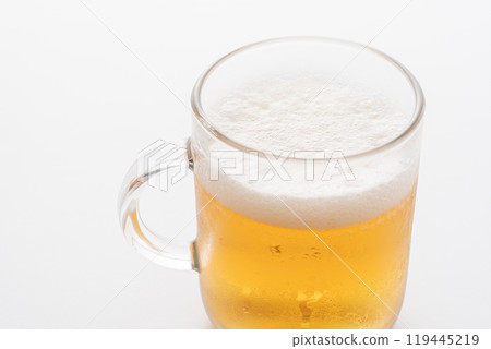 Beer poured into a glass with white background 119445219