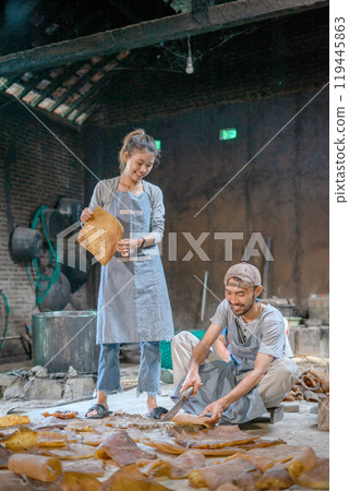 Skilled Artisans Expertly Crafting Traditional Leather Goods in Their Workshop Space Skilled Artisans Expertly Crafting Traditional Leather Goods in Their Workshop Space 119445863