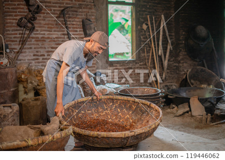 A Traditional Craftsman Skillfully Creating Handmade Baskets in a Cozy Brick Workshop A Traditional Craftsman Skillfully Creating Handmade Baskets in a Cozy Brick Workshop 119446062