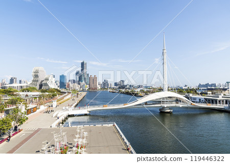 Panoramic view of Pier-2 Art Center and the Dagang Bridge (Great Harbor Bridge) in the port of Kaohsiung, Taiwan. with the famous Kaohsiung Music Center and 85 Sky Tower. Panoramic view of Pier-2 Art Center and the Dagang Bridge (Great Harbor Bridge) in the port of Kaohsiung, Taiwan. with the famous Kaohsiung Music Center and 85 Sky Tower. 119446322