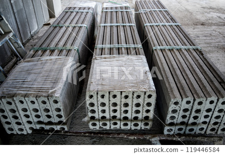 A large stack of concrete slabs on a construction site A large stack of concrete slabs on a construction site 119446584