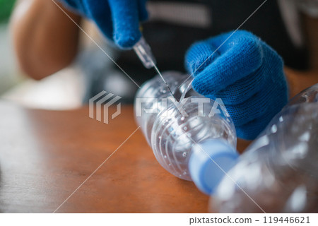cutting plastic bottle focus on recycle and reuse concept cutting plastic bottle focus on recycle and reuse concept 119446621