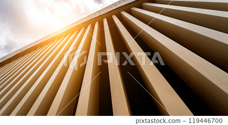 A structure featuring wooden slats on construction site contributing to its architectural style 119446700