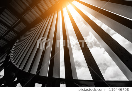 A structure featuring wooden slats on construction site contributing to its architectural style A structure featuring wooden slats on construction site contributing to its architectural style 119446708