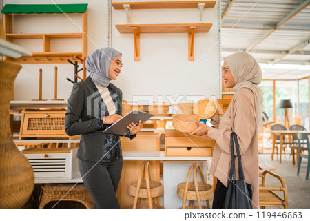 Women Engaging in Discussion About Business Ideas in a Contemporary Workspace Women Engaging in Discussion About Business Ideas in a Contemporary Workspace 119446863
