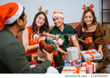 A Joyful and Merry Christmas Gathering with Wonderful Friends and Plenty of Gifts A Joyful and Merry Christmas Gathering with Wonderful Friends and Plenty of Gifts 119446949