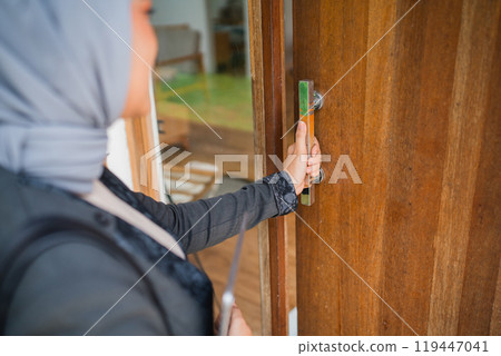close up of Muslim woman office worker standing holding door leaf 119447041