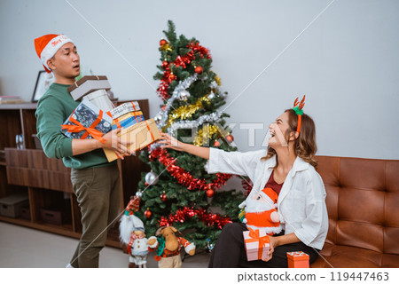 A Joyful and Festive Christmas Celebration Filled with Gifts and Decorations A Joyful and Festive Christmas Celebration Filled with Gifts and Decorations 119447463