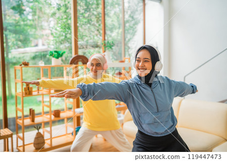 Women joyfully engaging in a home workout, fostering balance, community, and empowerment Women joyfully engaging in a home workout, fostering balance, community, and empowerment 119447473