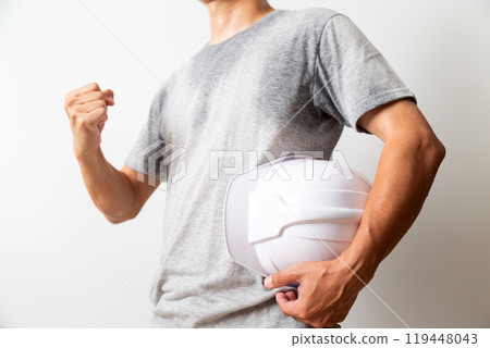 Middle-aged male manual worker with helmet 119448043