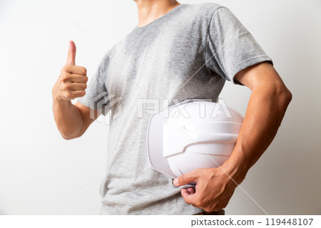 Middle-aged male manual worker with helmet Middle-aged male manual worker with helmet 119448107