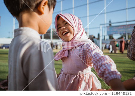Joyful children are playing together outdoors at a wonderful celebration event 119448121