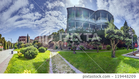 View of the historic city wall in Tbilisi, Georgia, showcasing architecture and greenery View of the historic city wall in Tbilisi, Georgia, showcasing architecture and greenery 119448209