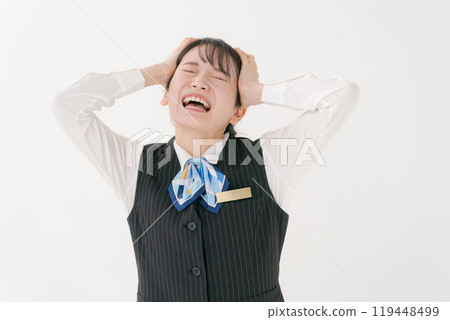 A woman in office clothes holding her head A woman in office clothes holding her head 119448499