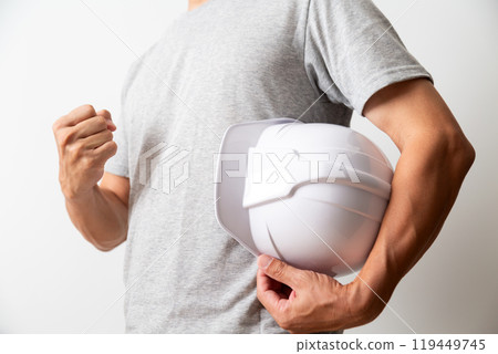 Middle-aged male manual worker with helmet Middle-aged male manual worker with helmet 119449745