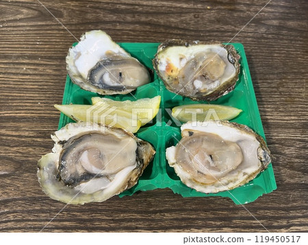 Raw oysters eaten at a market in Melbourne, Australia Raw oysters eaten at a market in Melbourne, Australia 119450517