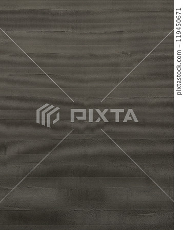 A vertical background image of a charcoal-colored painted wall with a kushihiki finish 119450671