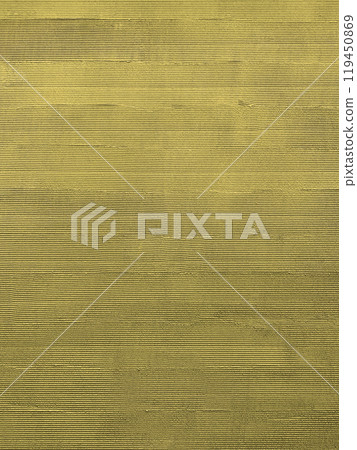 A vertical background image of a mustard-colored plastered wall finished with a comb-brushing technique 119450869