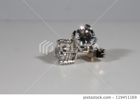 Diamond earrings. Big diamond earrings, large solitaire earrings on white background. 119451169