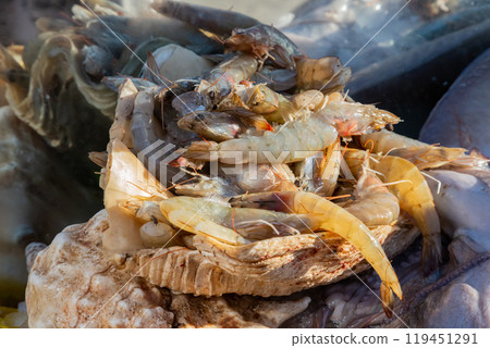 Shrimp. Fresh raw shrimps at the market for sell. Heap of prawns with top view. Shrimp. Fresh raw shrimps at the market for sell. Heap of prawns with top view. 119451291