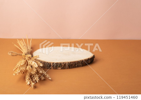 The podium is made of natural wood and decorated with spikelets. Showcase, product presentation. 119451460