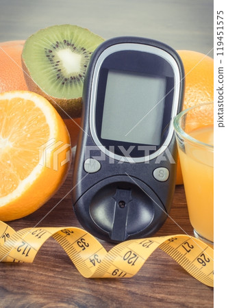 Glucose meter for checking sugar level, fresh fruits Glucose meter for checking sugar level, fresh fruits 119451575
