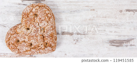 Fresh homemade wholegrain bread in shape of heart for breakfast 119451585
