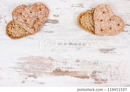 Fresh homemade wholegrain bread in shape of heart for breakfast 119451587