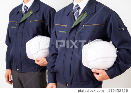 Middle-aged male businessman in work clothes Middle-aged male businessman in work clothes 119452226