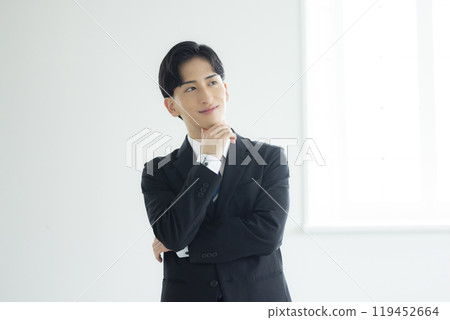 A thoughtful young businessman 119452664
