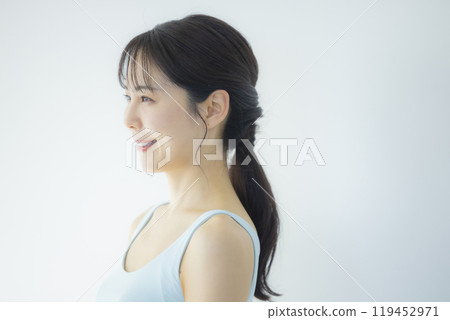 Young woman in a light blue dress 119452971