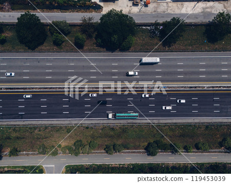 Top view of the highway car road. Aerial view of motorway junction, toll way, road traffic, Highway an important infrastructure, Expressway road, transportation and travel concept Top view of the highway car road. Aerial view of motorway junction, toll way, road traffic, Highway an important infrastructure, Expressway road, transportation and travel concept 119453039