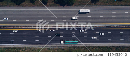 Top view of the highway car road. Aerial view of motorway junction, toll way, road traffic, Highway an important infrastructure, Expressway road, transportation and travel concept Top view of the highway car road. Aerial view of motorway junction, toll way, road traffic, Highway an important infrastructure, Expressway road, transportation and travel concept 119453040