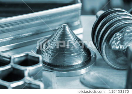 Model printed on 3D printer from metal. Object created on 3D printer from melting metal thread. Modern new technologies. Additive progressive manufacturing solution. Metal 3d printing technology Model printed on 3D printer from metal. Object created on 3D printer from melting metal thread. Modern new technologies. Additive progressive manufacturing solution. Metal 3d printing technology 119453170