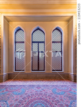 Stunning Interior View of Imamzadeh Mosque Showcasing Intricate Windows and Vibrant Carpet in Ganja, Azerbaijan Stunning Interior View of Imamzadeh Mosque Showcasing Intricate Windows and Vibrant Carpet in Ganja, Azerbaijan 119453233