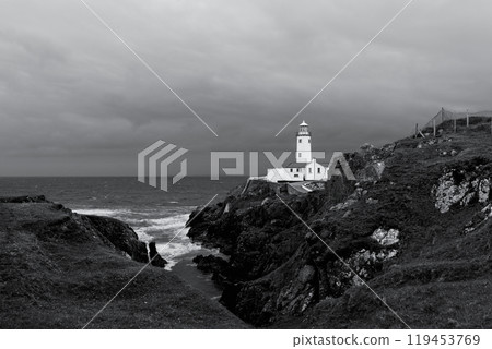 Monochrome photo of Fanad Head Lighthouse during storm highlighting contrasts of sea cliffs Monochrome photo of Fanad Head Lighthouse during storm highlighting contrasts of sea cliffs 119453769