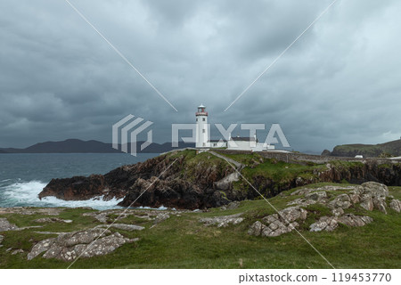 Fanad Head Lighthouse on cliffs with stormy skies and crashing waves along the Irish coast Fanad Head Lighthouse on cliffs with stormy skies and crashing waves along the Irish coast 119453770