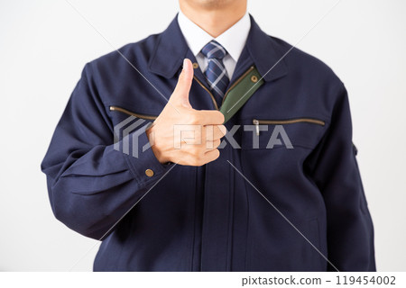 A middle-aged male businessman in work clothes giving a thumbs up 119454002