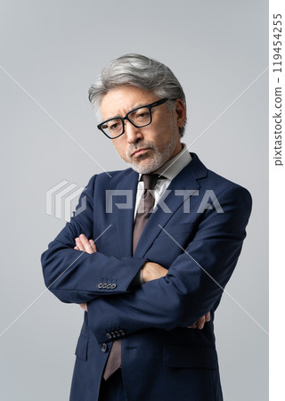 Businessman worried about gray hair 119454255