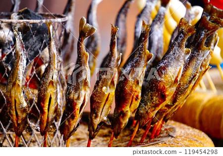 Charcoal grilling of river fish Charcoal grilling of river fish 119454298