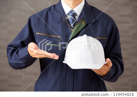 Middle-aged male businessman in work clothes Middle-aged male businessman in work clothes 119454828