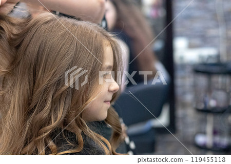 Close-up of a girl in a hairdresser, beauty salon Close-up of a girl in a hairdresser, beauty salon 119455118
